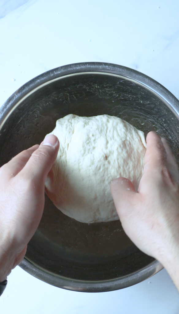 Mix together flour, yeast, water, oil and salt. Roll into 6 balls and let rise.